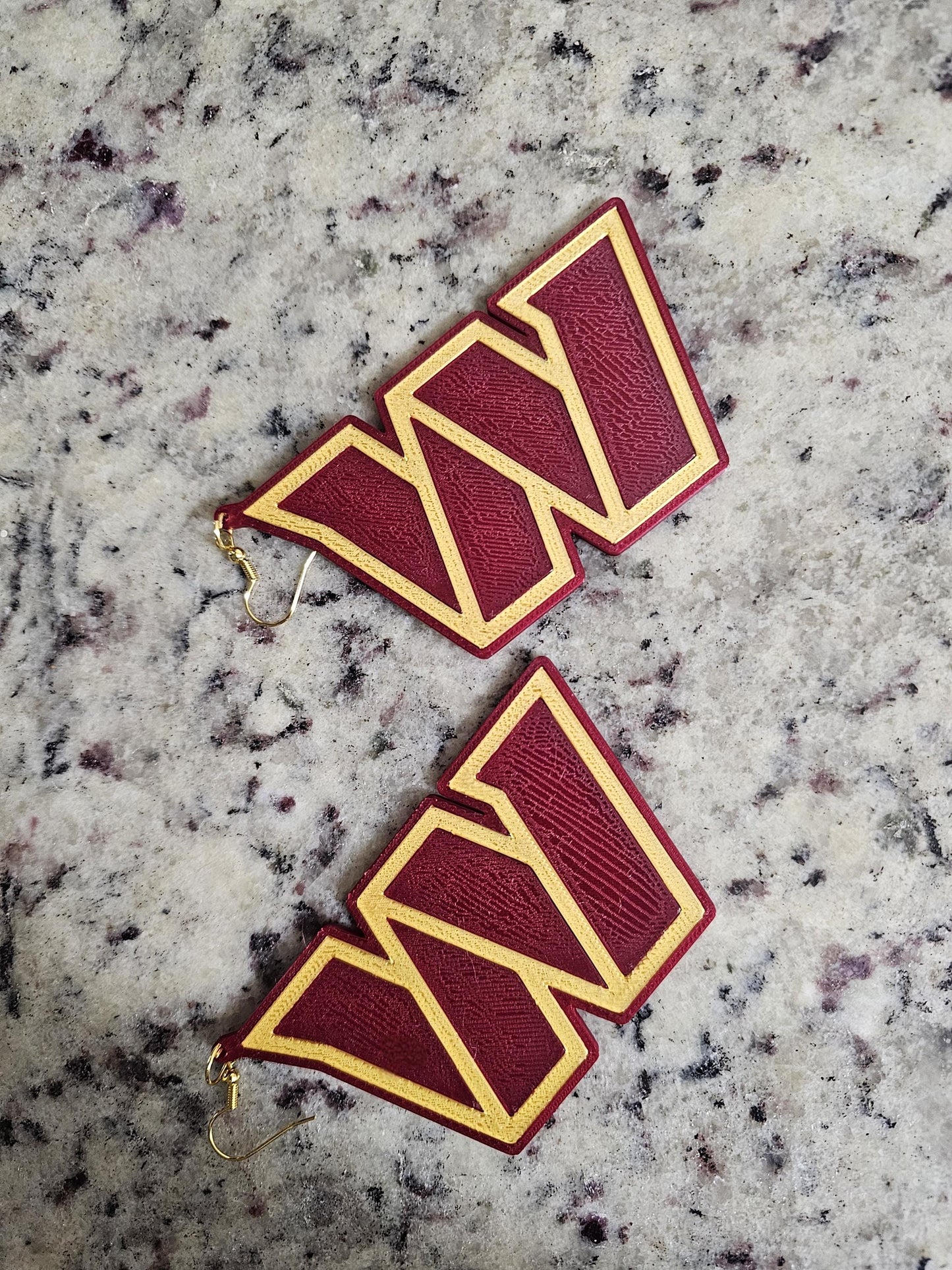 Oversized lightweight Commanders earrings